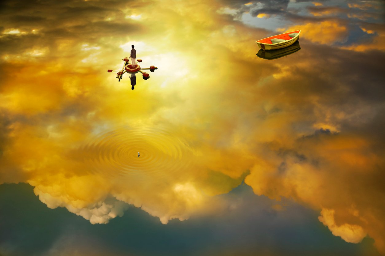 An image of a person standing on a platform in a lake, with a boat nearby